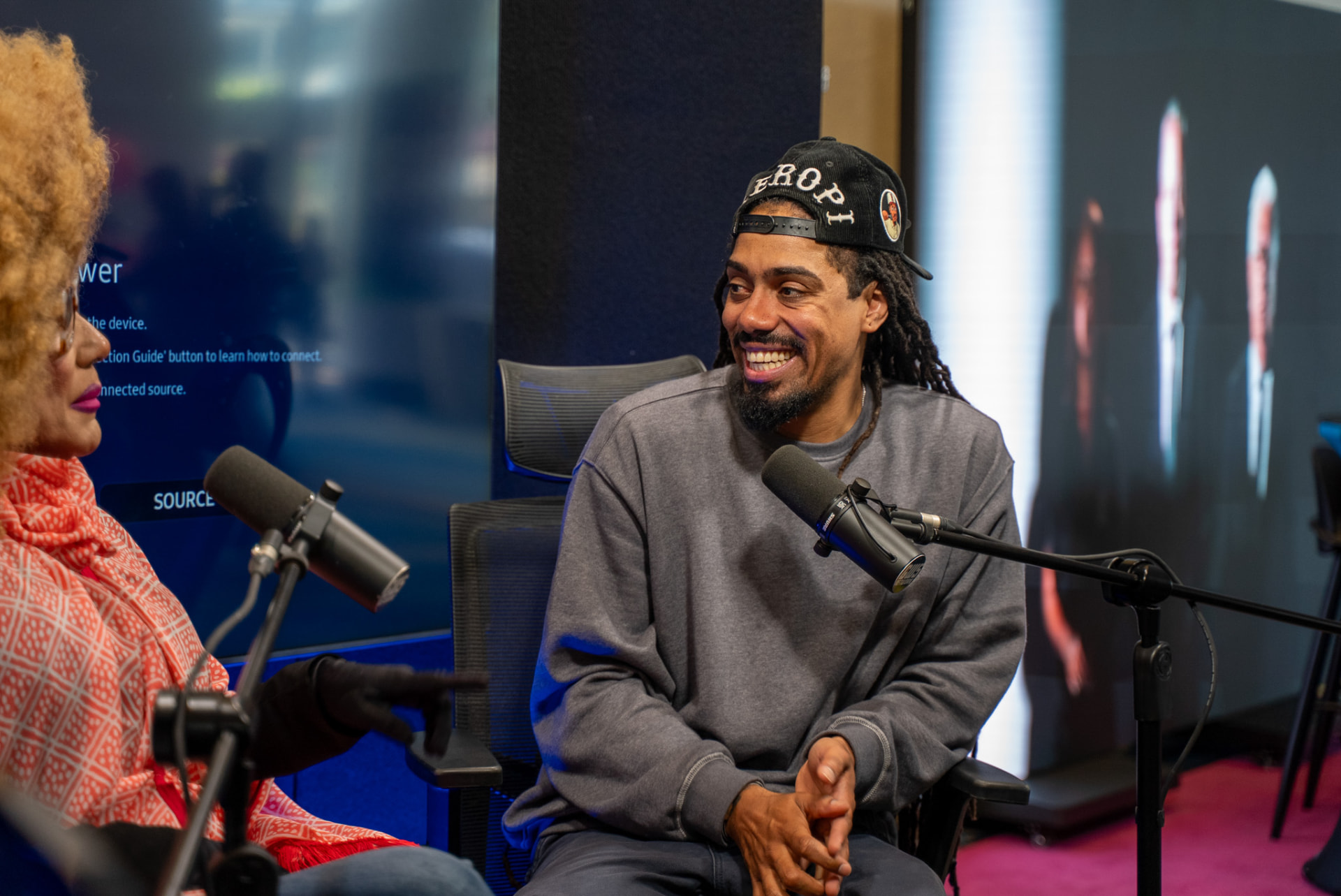 Guest smiling during a recorded event conversation