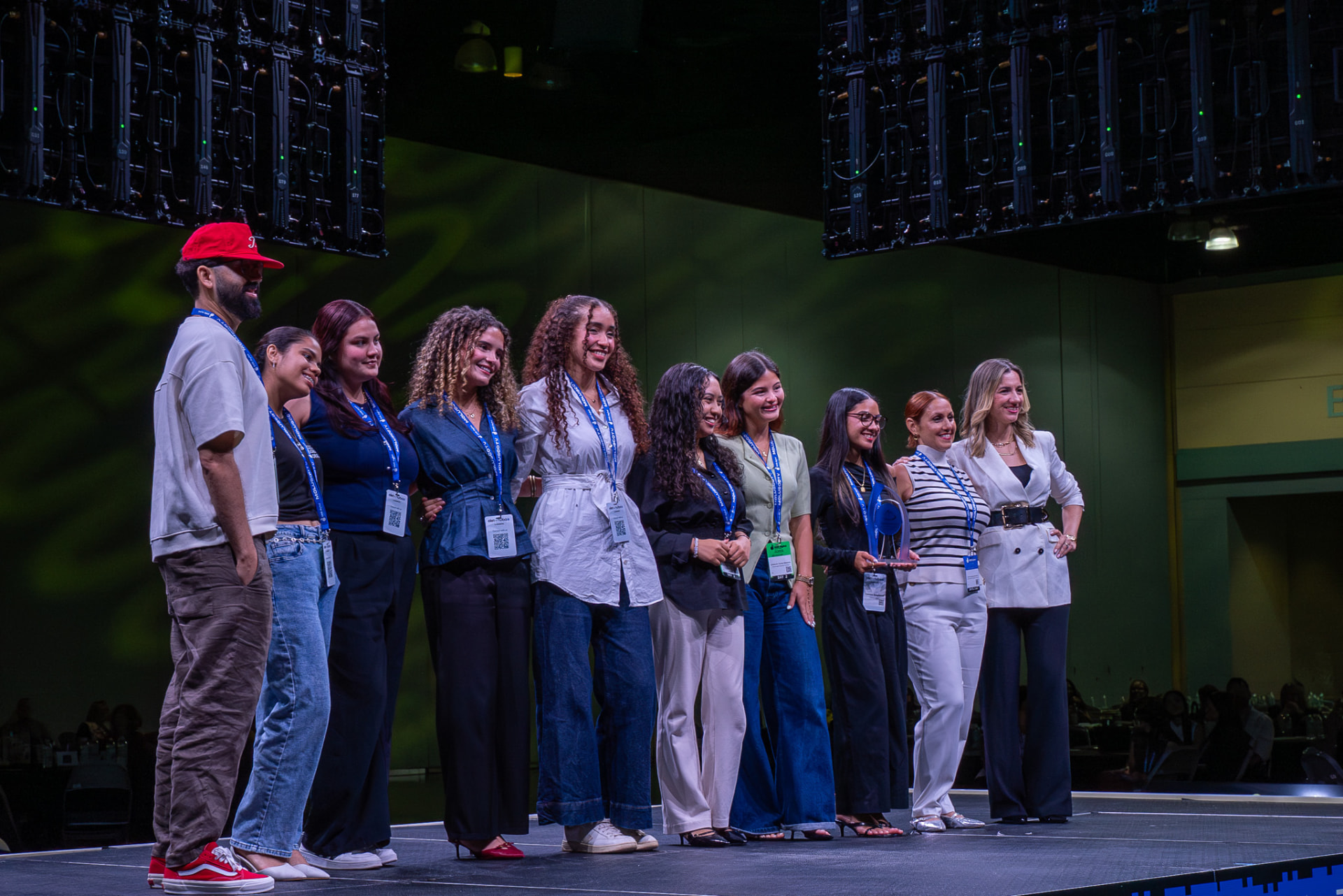 Event team posing together on stage