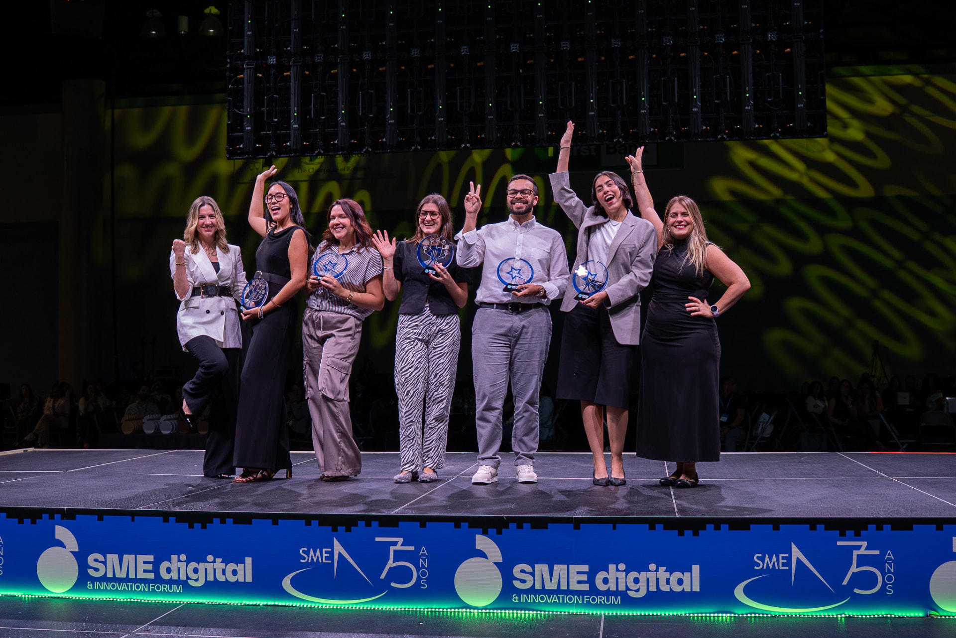 Award winners celebrating together on stage